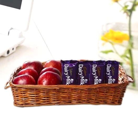 Apples in a Basket Along With Dairy Milk Chocolates: